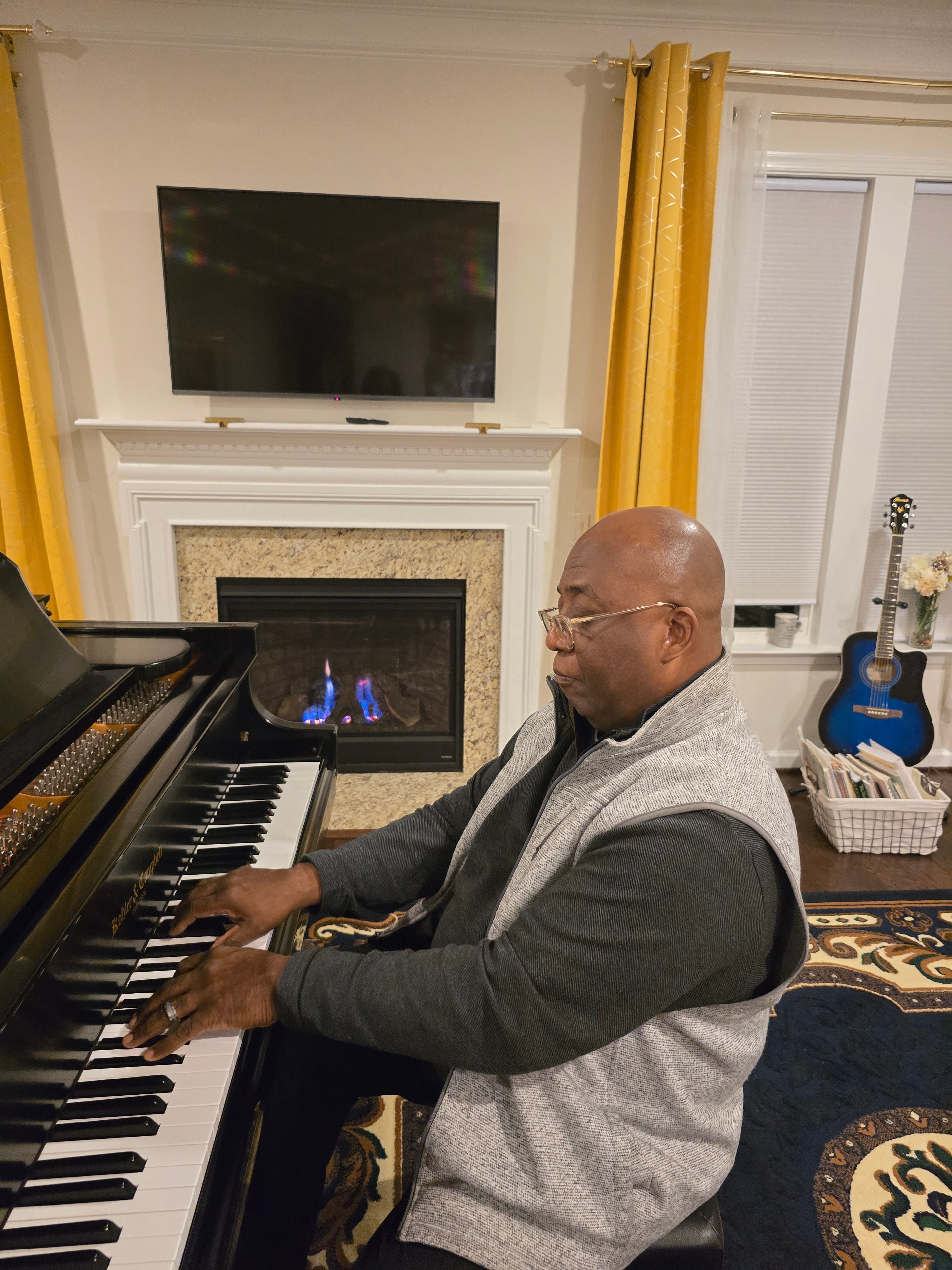 Karl Nichols playing piano at Harmony Keys of Life studio
